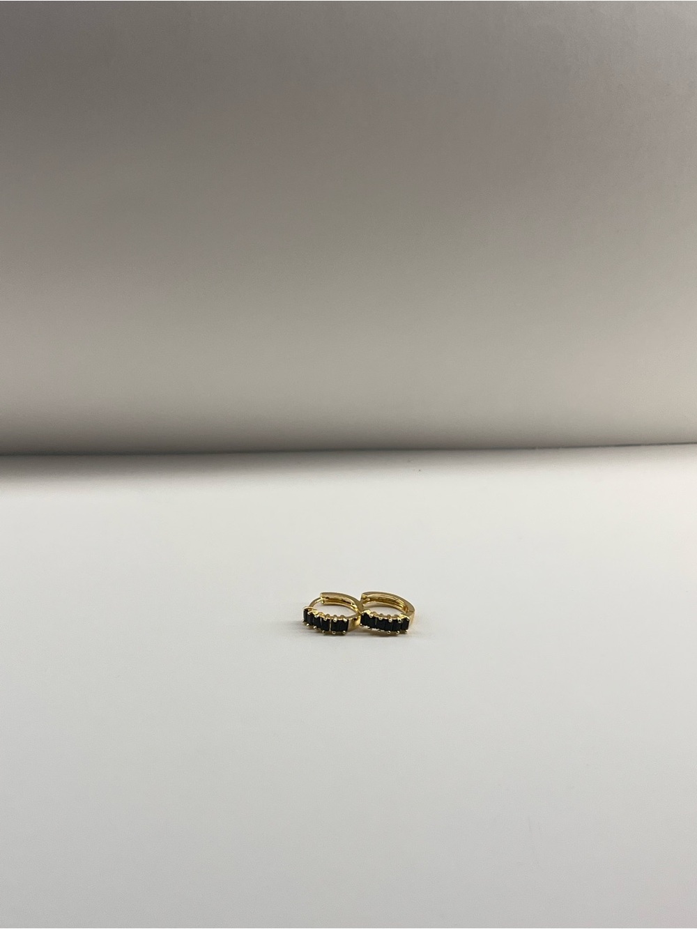Gold Huggie Hoop Earrings with Black Stones